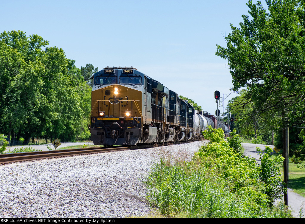 CSX 3407 leads a manifest north at MP 57 